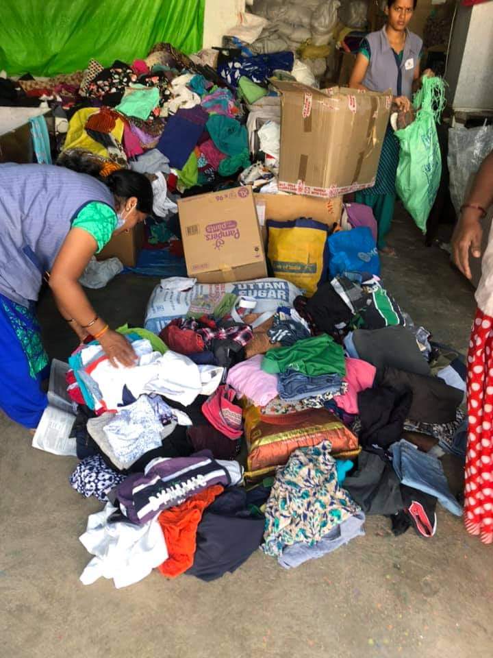 Sorting Donated Clothes Together